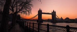 Preview wallpaper bridge, city, water, trees, sunset, embankment, dark