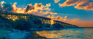 Preview wallpaper bridge, clouds, water, sunset, nature, landscape