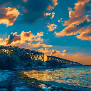 Preview wallpaper bridge, clouds, water, sunset, nature, landscape