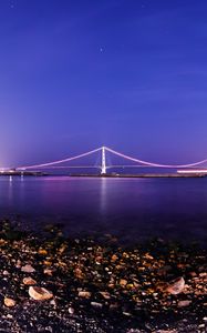 Preview wallpaper bridge, coast, stones, pebbles, shells, twilight