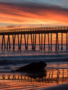 Preview wallpaper bridge, construction, sea, stones, sunset