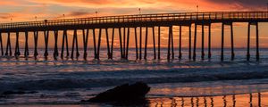 Preview wallpaper bridge, construction, sea, stones, sunset