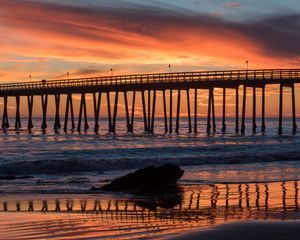 Preview wallpaper bridge, construction, sea, stones, sunset