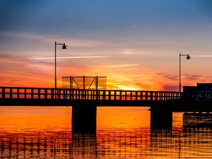 Preview wallpaper bridge, construction, water, sunset, dark