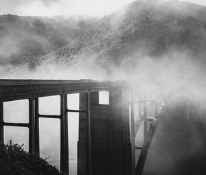 Preview wallpaper bridge, fog, mountains, slopes, black and white