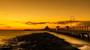 Preview wallpaper bridge, lights, rocks, sunset