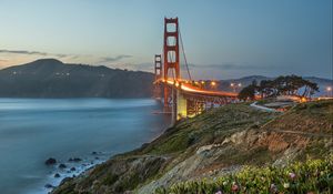 Preview wallpaper bridge, lights, slope, sea, strait