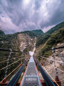 Preview wallpaper bridge, mountains, girl, solitude, walk, height