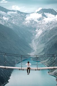 Preview wallpaper bridge, mountains, man, height, loneliness