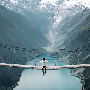 Preview wallpaper bridge, mountains, man, height, loneliness