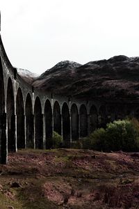 Preview wallpaper bridge, mountains, ruins