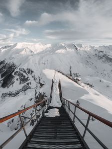 Preview wallpaper bridge, mountains, snow, peak, mountain range