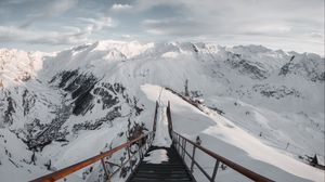 Preview wallpaper bridge, mountains, snow, peak, mountain range
