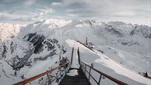 Preview wallpaper bridge, mountains, snow, peak, mountain range