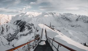 Preview wallpaper bridge, mountains, snow, peak, mountain range