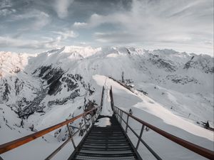 Preview wallpaper bridge, mountains, snow, peak, mountain range