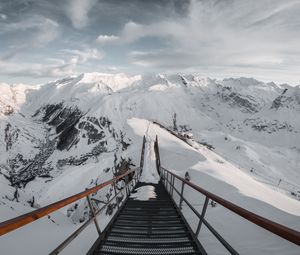 Preview wallpaper bridge, mountains, snow, peak, mountain range