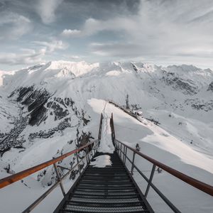 Preview wallpaper bridge, mountains, snow, peak, mountain range