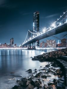 Preview wallpaper bridge, night city, coast, city lights, stones