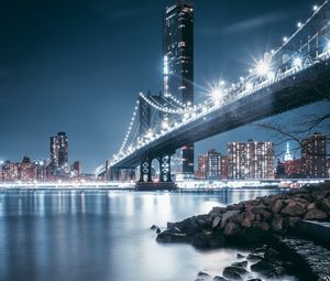 Preview wallpaper bridge, night city, coast, city lights, stones