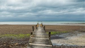 Preview wallpaper bridge, pier, beach, sea, horizon, clouds, sky, landscape