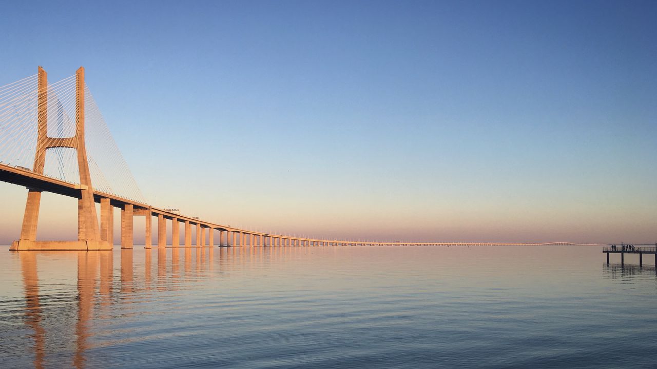 Wallpaper bridge, pilings, reflections, sea, sky