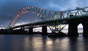 Preview wallpaper bridge, pilings, river, garlands, evening