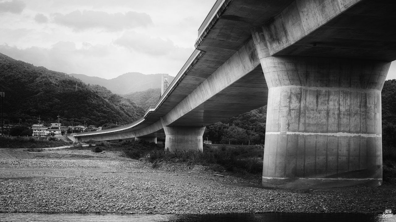 Wallpaper bridge, pilings, river, bw, mountains