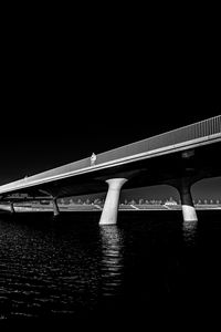 Preview wallpaper bridge, pilings, river, black and white