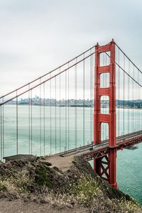 Preview wallpaper bridge, pilings, road, cars, sea