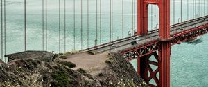 Preview wallpaper bridge, pilings, road, cars, sea