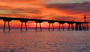 Preview wallpaper bridge, pilings, sea, sunset, nature
