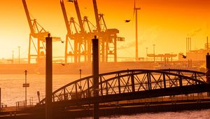 Preview wallpaper bridge, pilings, sea, twilight