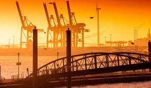 Preview wallpaper bridge, pilings, sea, twilight