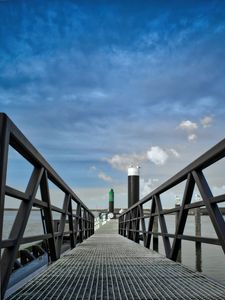 Preview wallpaper bridge, pillings, metal, sea, sky