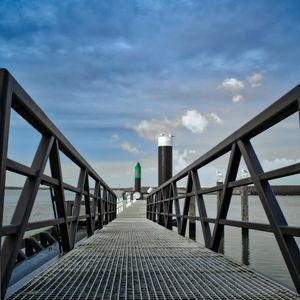 Preview wallpaper bridge, pillings, metal, sea, sky