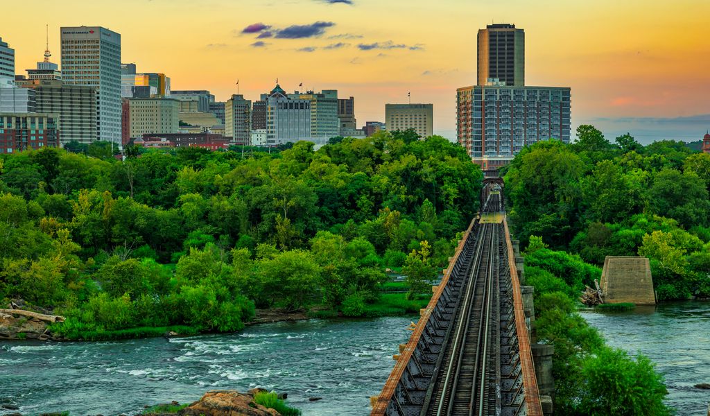 1024x600 Wallpaper bridge, railway, river, city, sunset, landscape