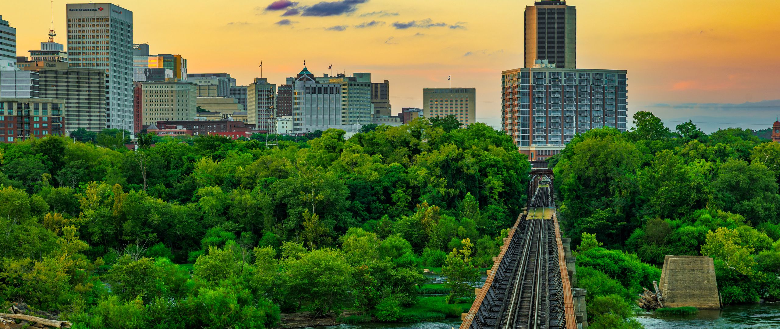 2560x1080 Wallpaper bridge, railway, river, city, sunset, landscape