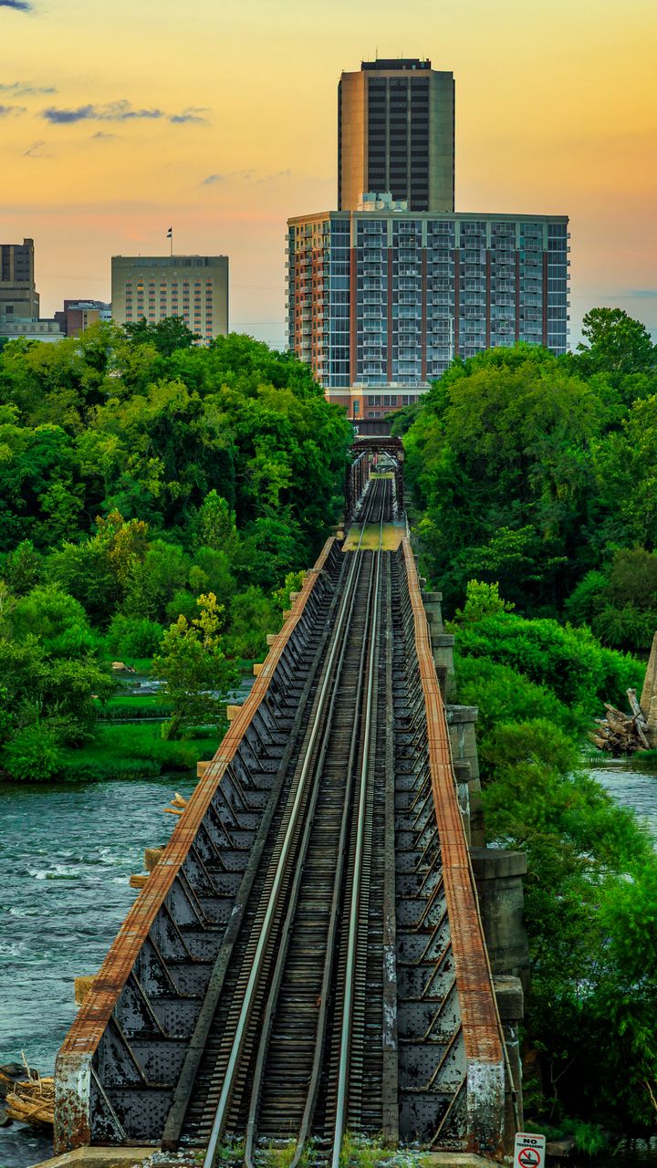 720x1280 Wallpaper bridge, railway, river, city, sunset, landscape
