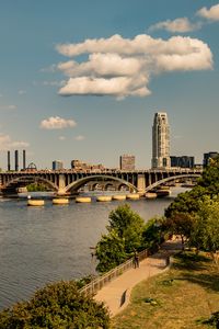 Preview wallpaper bridge, river, buildings, trees, clouds, sky