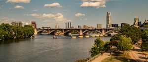 Preview wallpaper bridge, river, buildings, trees, clouds, sky