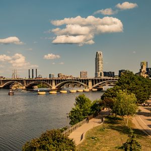 Preview wallpaper bridge, river, buildings, trees, clouds, sky