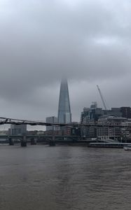 Preview wallpaper bridge, river, buildings, fog, construction