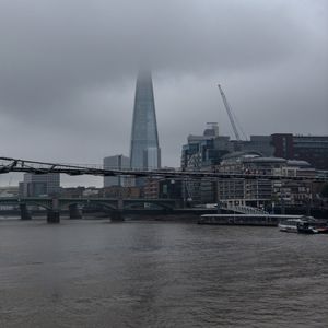 Preview wallpaper bridge, river, buildings, fog, construction