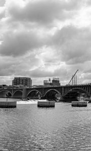 Preview wallpaper bridge, river, clouds, buildings, black and white
