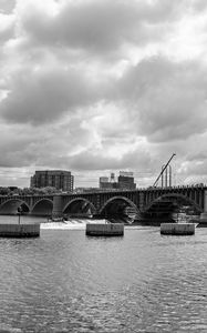Preview wallpaper bridge, river, clouds, buildings, black and white