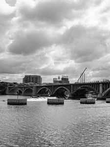 Preview wallpaper bridge, river, clouds, buildings, black and white