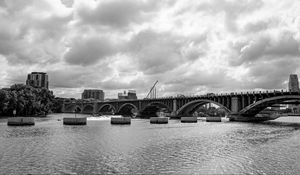 Preview wallpaper bridge, river, clouds, buildings, black and white