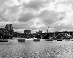Preview wallpaper bridge, river, clouds, buildings, black and white