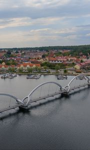 Preview wallpaper bridge, river, houses, pier, boats, sweden